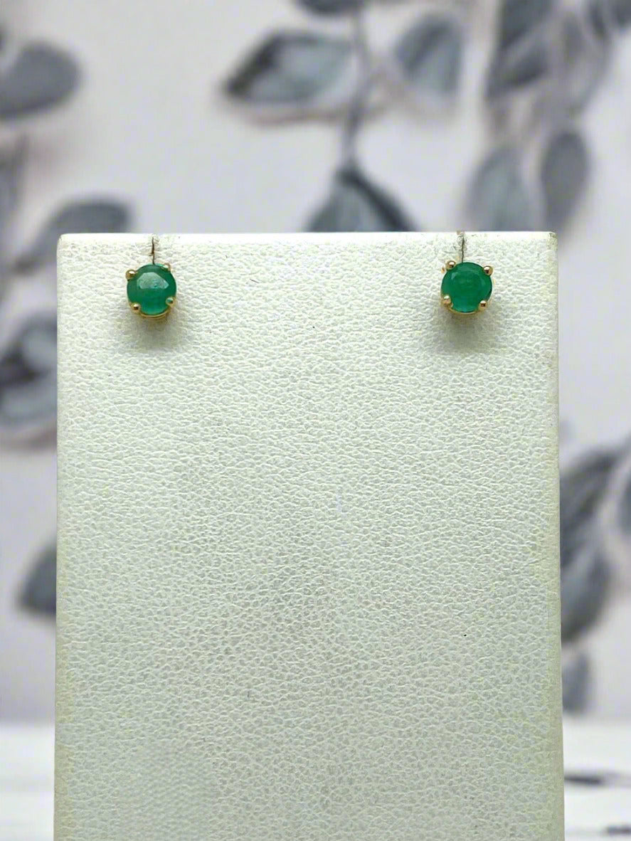 Pair of yellow gold and green emerald stud earrings