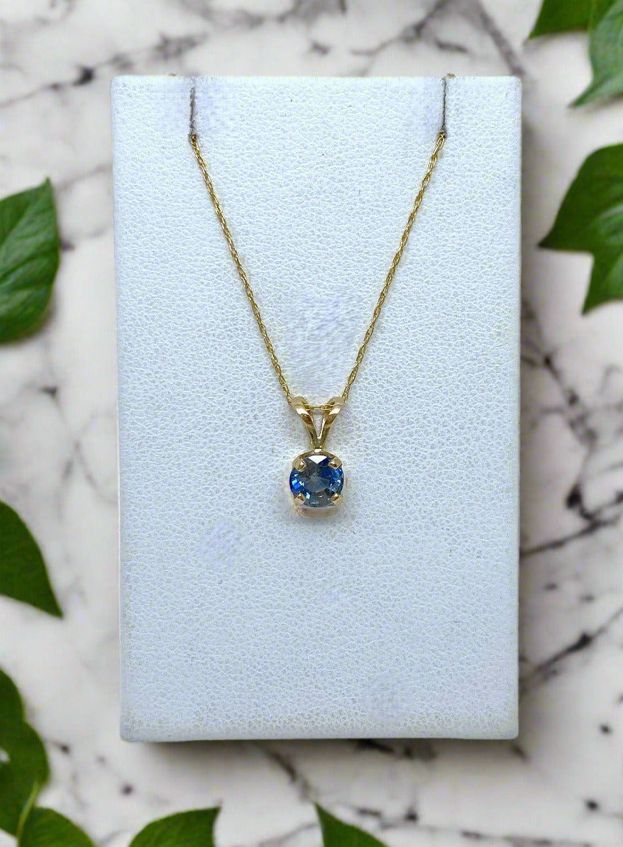 round blue sapphire solitaire pendant on gold chain