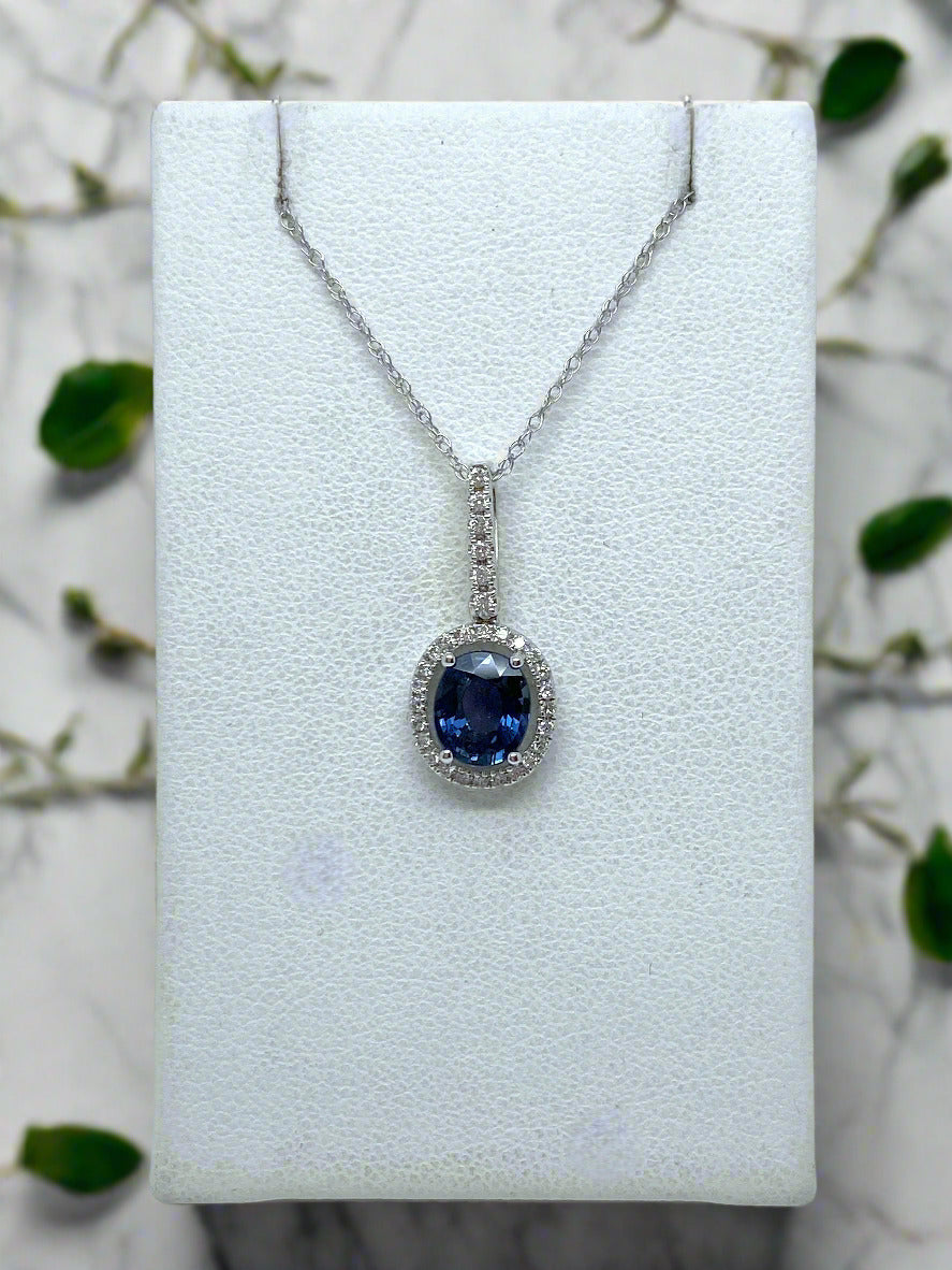 white gold chain and pendant with oval blue sapphire and diamond accents