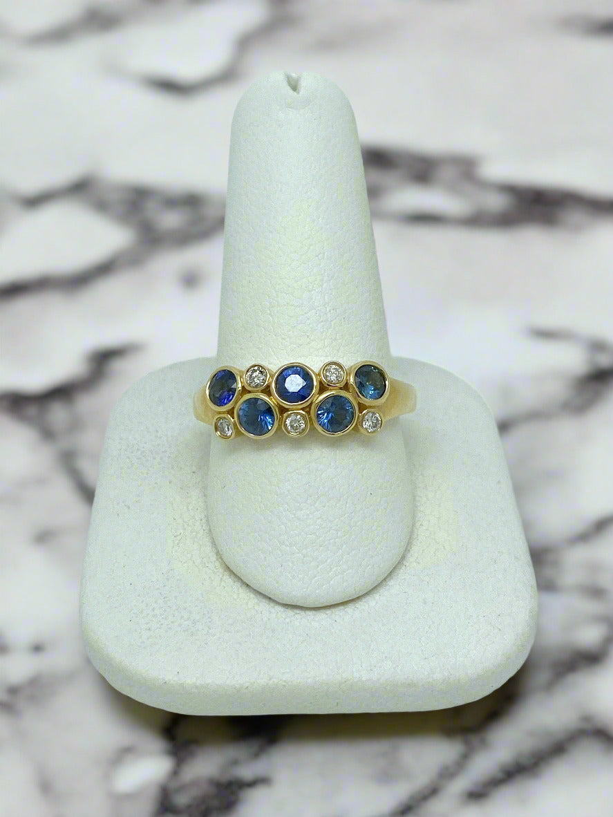 yellow gold ring with blue sapphires and diamonds