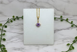yellow gold necklace with round amethyst pendant with diamond accent