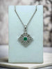white gold necklace with emerald and diamonds
