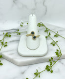 14 karat yellow gold open bypass ring with two round blue sapphires