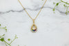 yellow gold chain and teardrop pendant, set with halo of diamonds and multi-colored sapphires