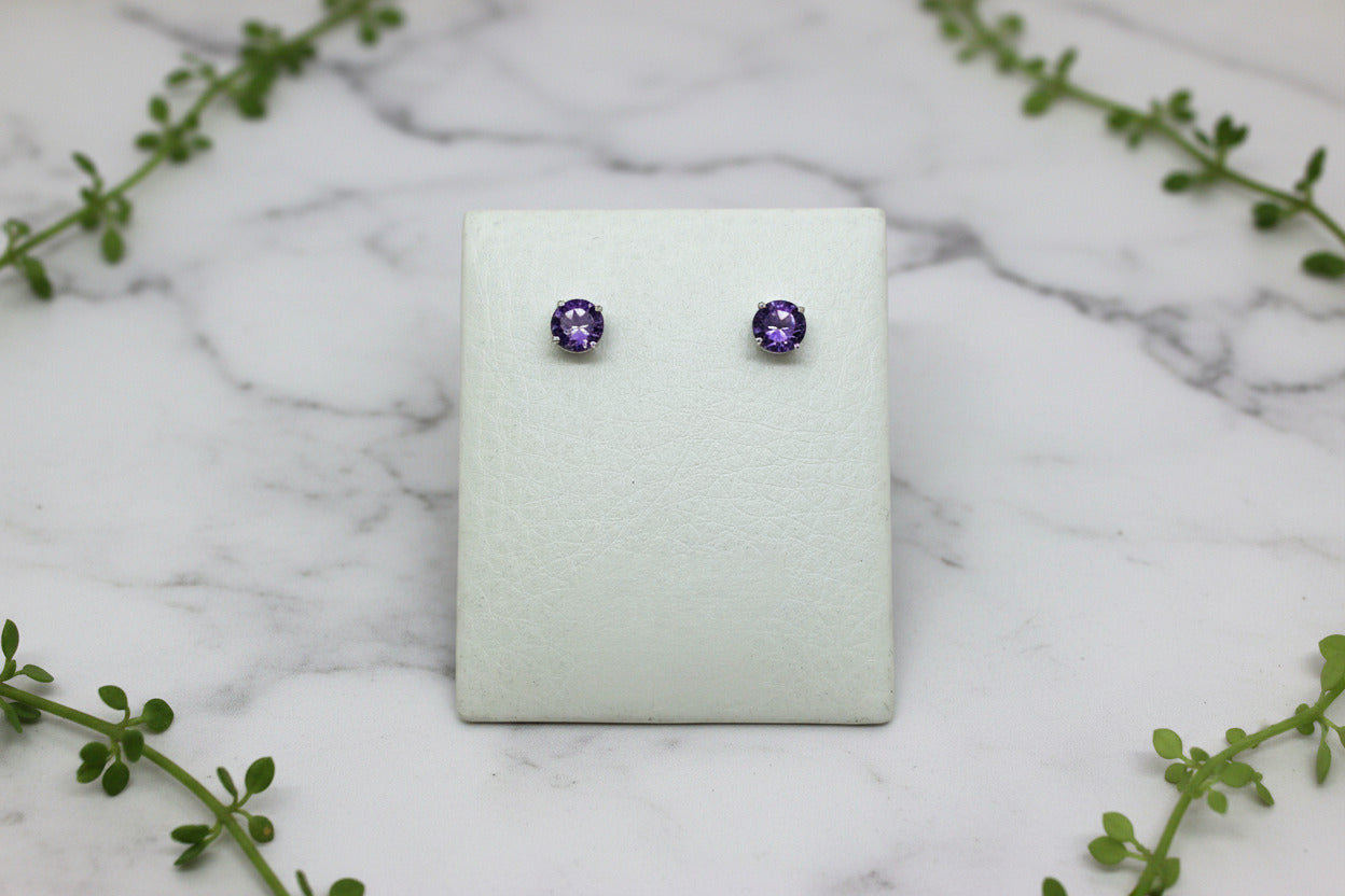 white gold studs with round amethysts