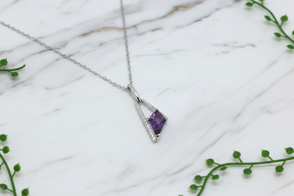 white gold necklace with asymmetrical kite-cut amethyst pendant and diamond accents