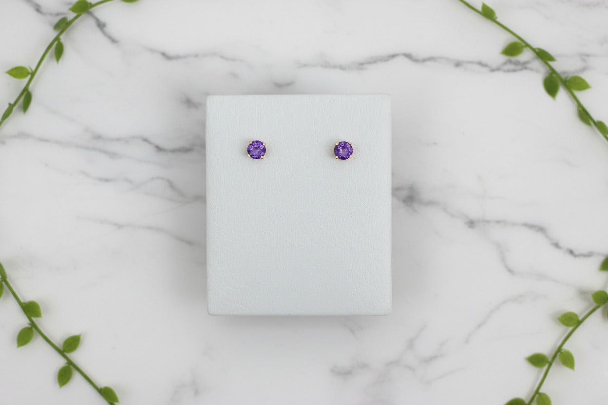 yellow gold stud earrings with round amethysts