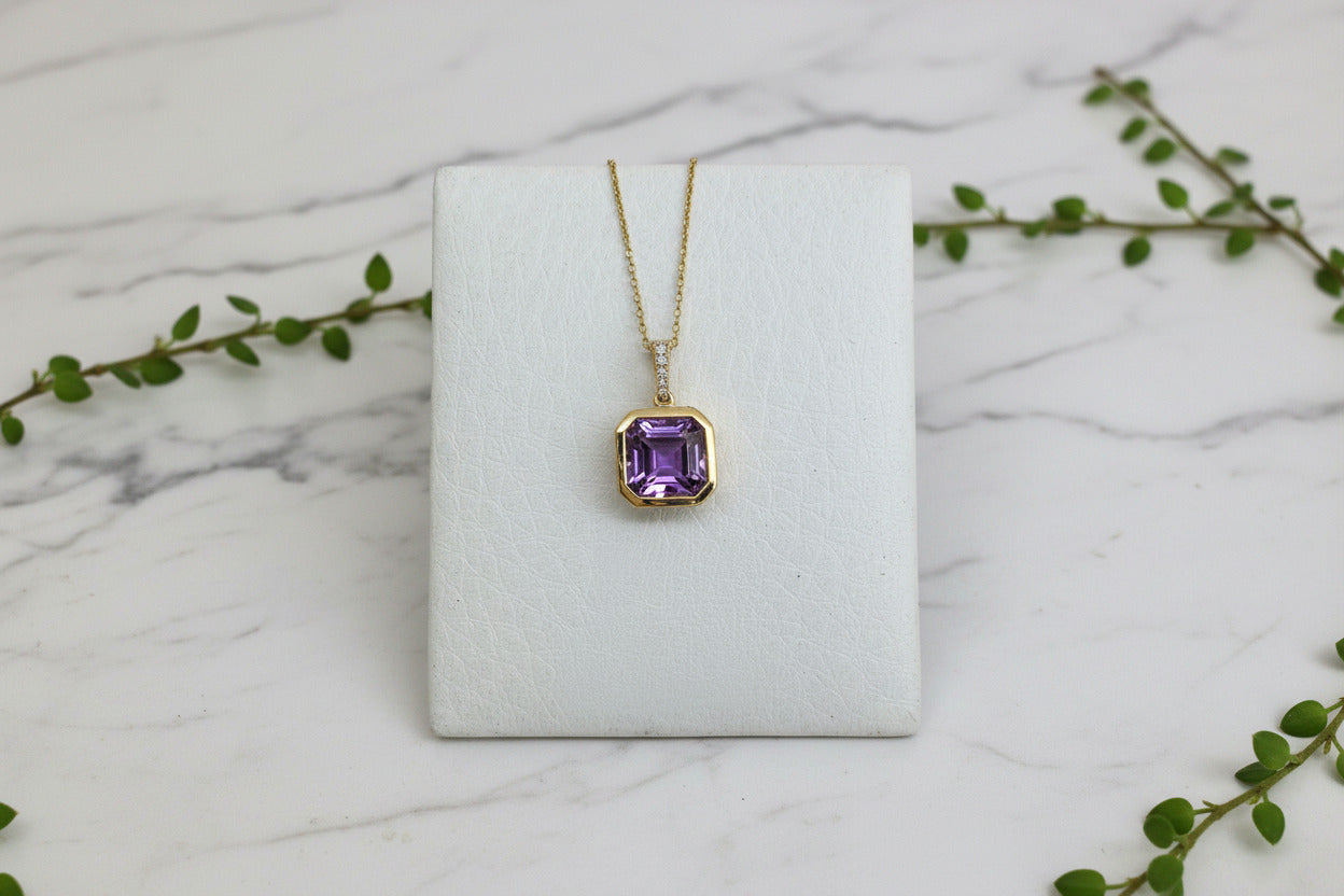 yellow gold necklace with cushion cut amethyst pendant 