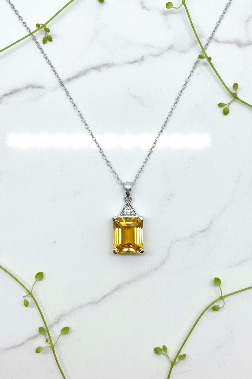 white gold pendant and chain with emerald cut citrine and diamond accents