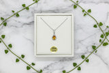 white gold necklace with pear-shaped citrine pendant with diamond halo