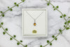 white gold necklace with pear-shaped citrine pendant with diamond halo