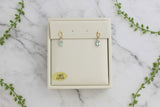 yellow gold dangle earrings with oval aquamarines and diamond accents