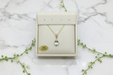 yellow gold necklace with aquamarine pendant and diamond accent