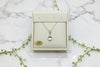 yellow gold necklace with aquamarine pendant and diamond accent