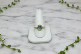 yellow gold solitaire ring set with hexagonal cut green lab-grown spinel