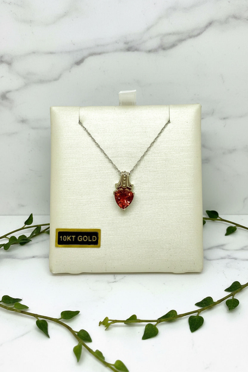 white gold chain and pendant set with trillion cut oregon sunstone and diamond accents