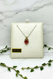white gold chain and pendant set with trillion cut oregon sunstone and diamond accents