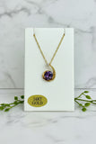 yellow gold chain and freeform pendant with lab created alexandrite center stone and diamond accent at top point