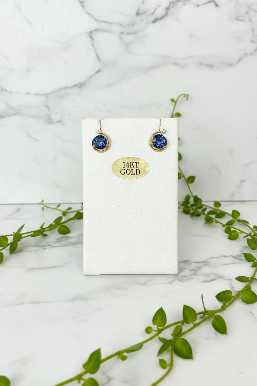 yellow gold stud earrings in a lunar/celestial design with round lab-created alexandrite center stones and diamond accent at top of earring
