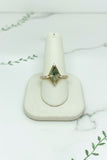 yellow gold ring with kite shaped moss agate center stone and 8 diamond accent stones