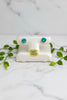 yellow gold stud earrings set with green lab-grown paraiba garnets