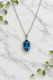 white gold necklace and pendant set with London blue topaz, blue sapphires, and accent diamonds